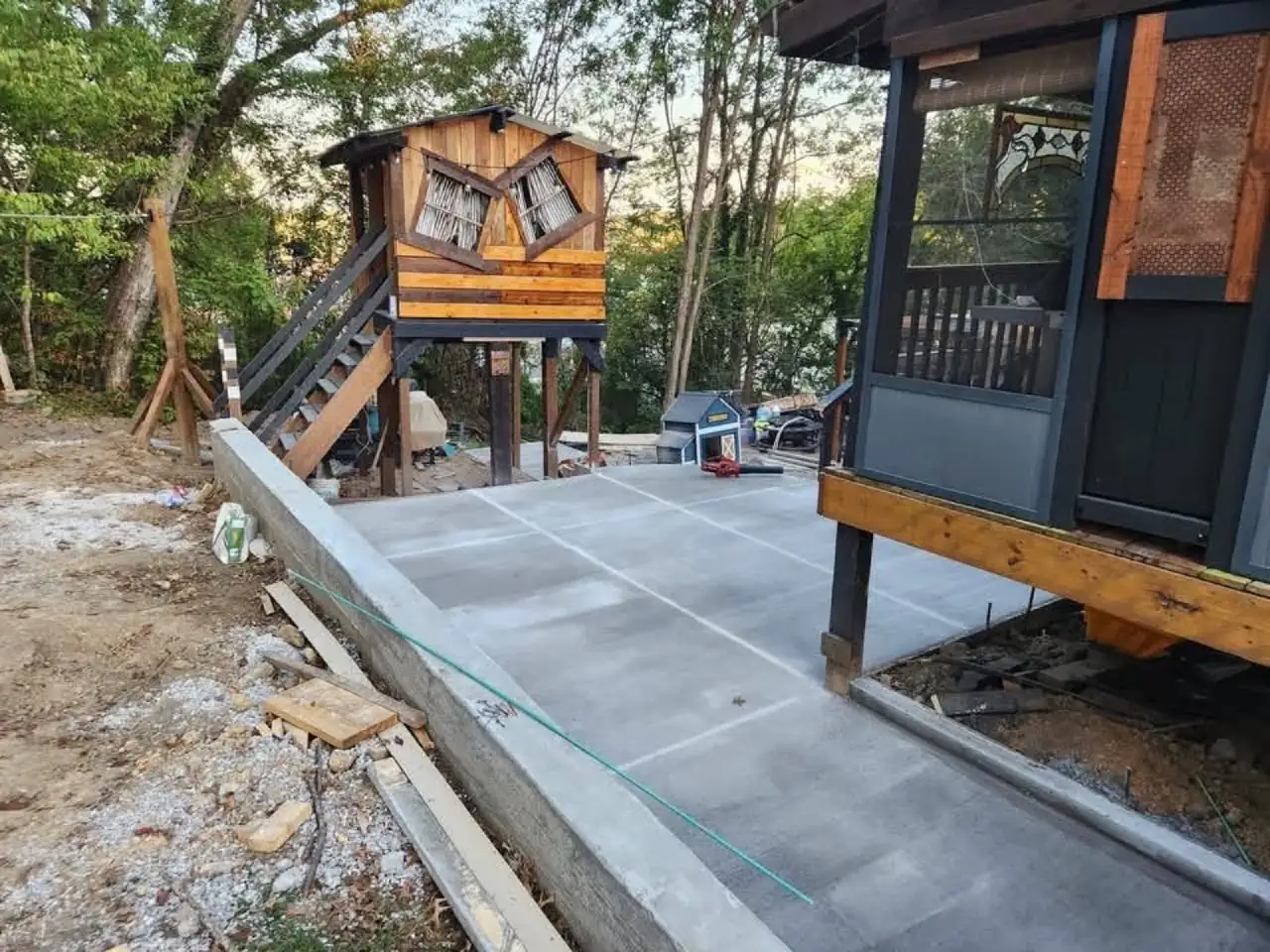 Integrated raised timber deck with concrete patio below in London Kentucky