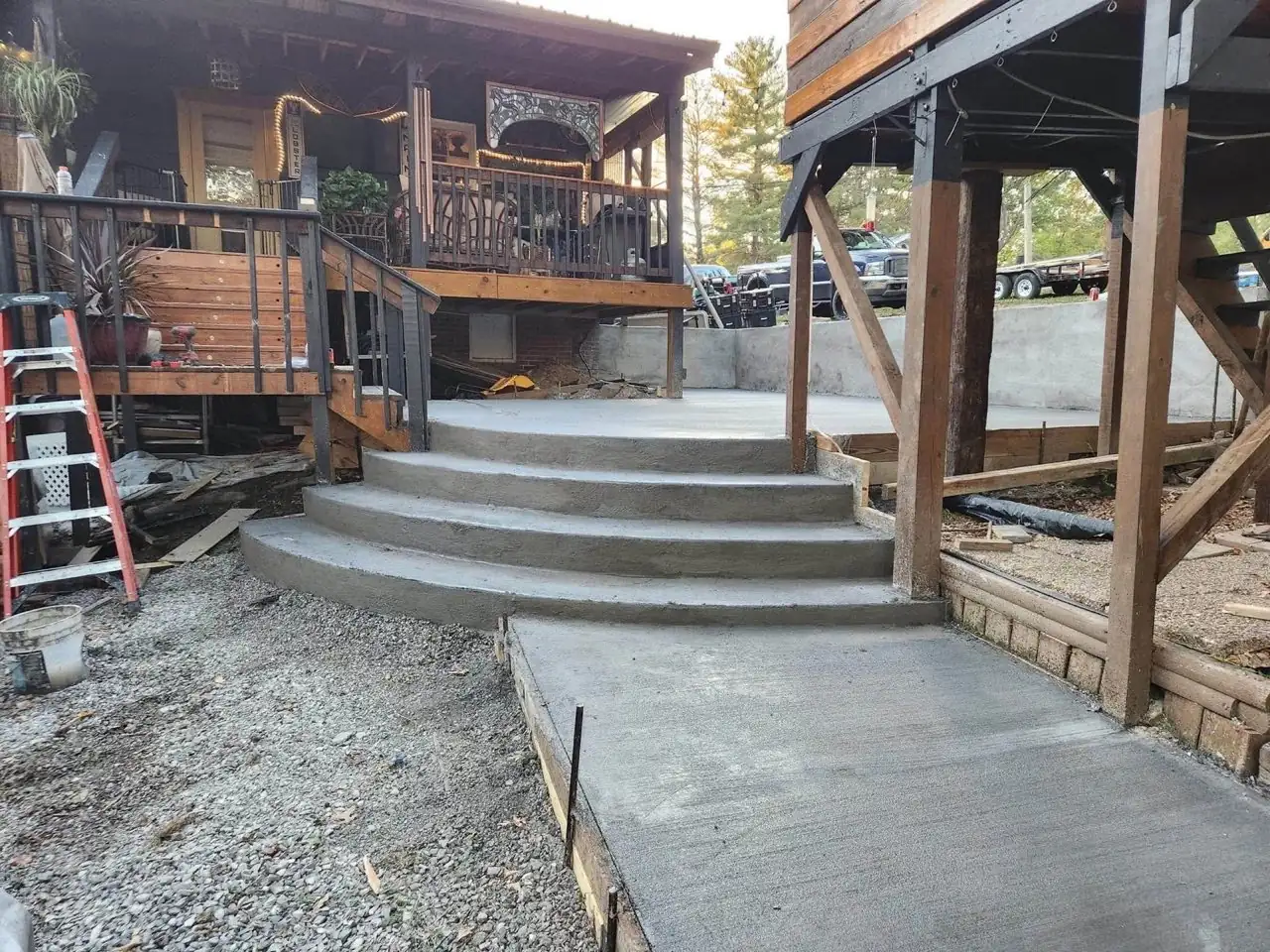 Custom curved concrete steps formed and poured along an outdoor slope